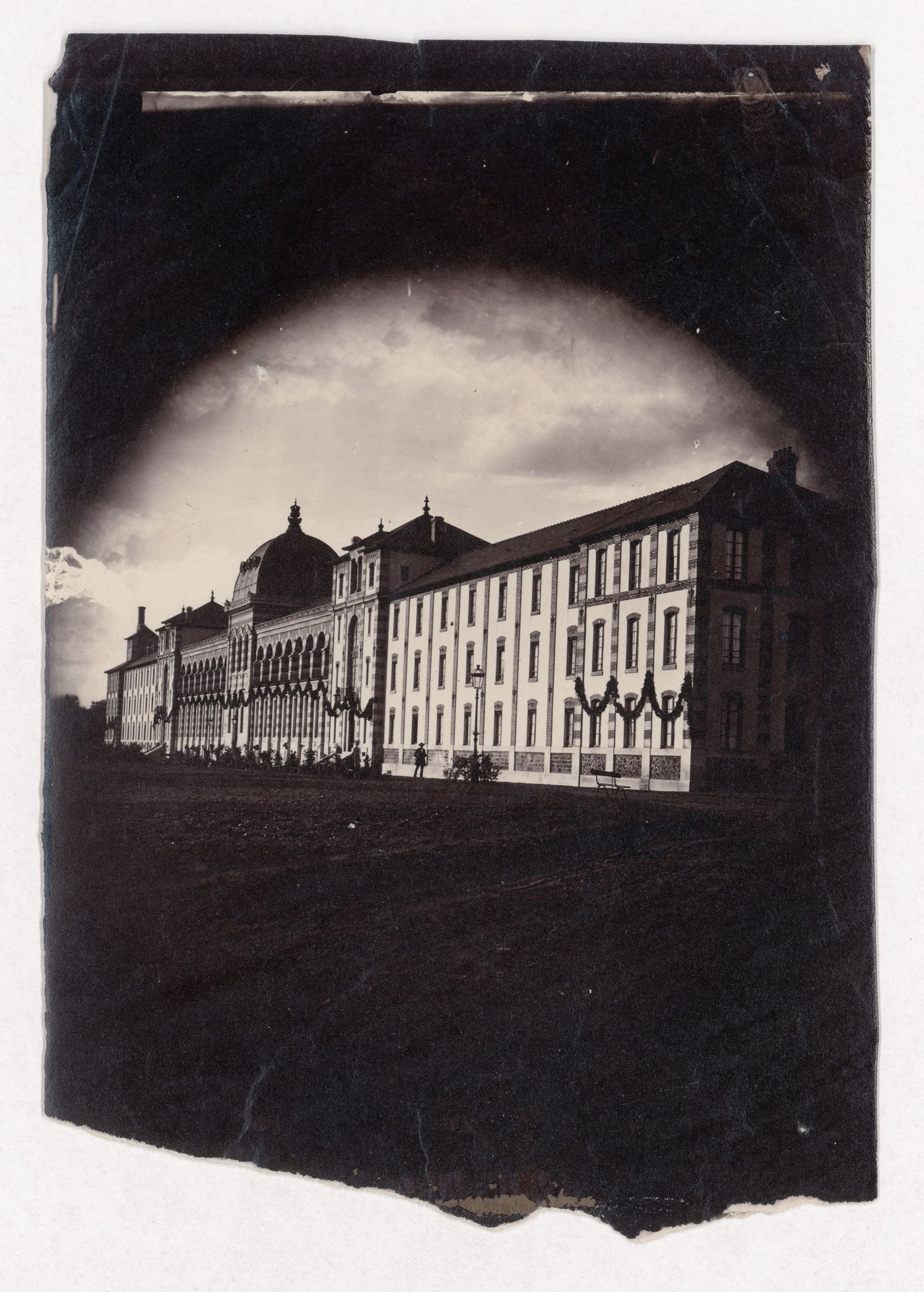 General view of façade of Imperial Asylum [?] on a diagonal, Vincennes, France