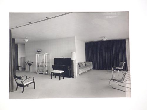 Interior, living room with piano, glass case, and tubular steel chairs, Germany
