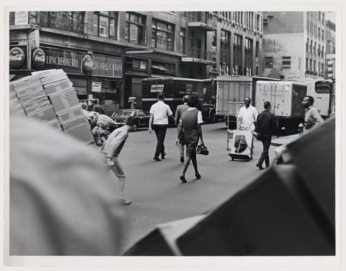 Street view with pedestrians, workers, service trucks and building facades, West 37th Street, Manhattan, New York City, New York
