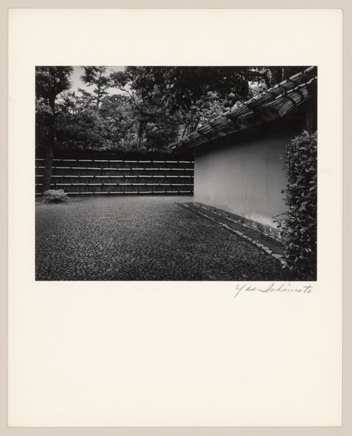 View of the paved courtyard and earthen wall near the Central Gate (also known as the Inner Gate), Katsura Rikyu (also known as Katsura Imperial Villa), Kyoto, Japan