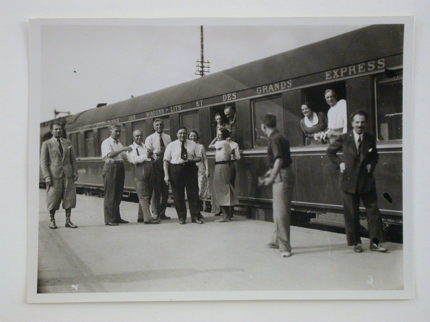 Group portrait of study tour members on a train stop in Hannover, Germany