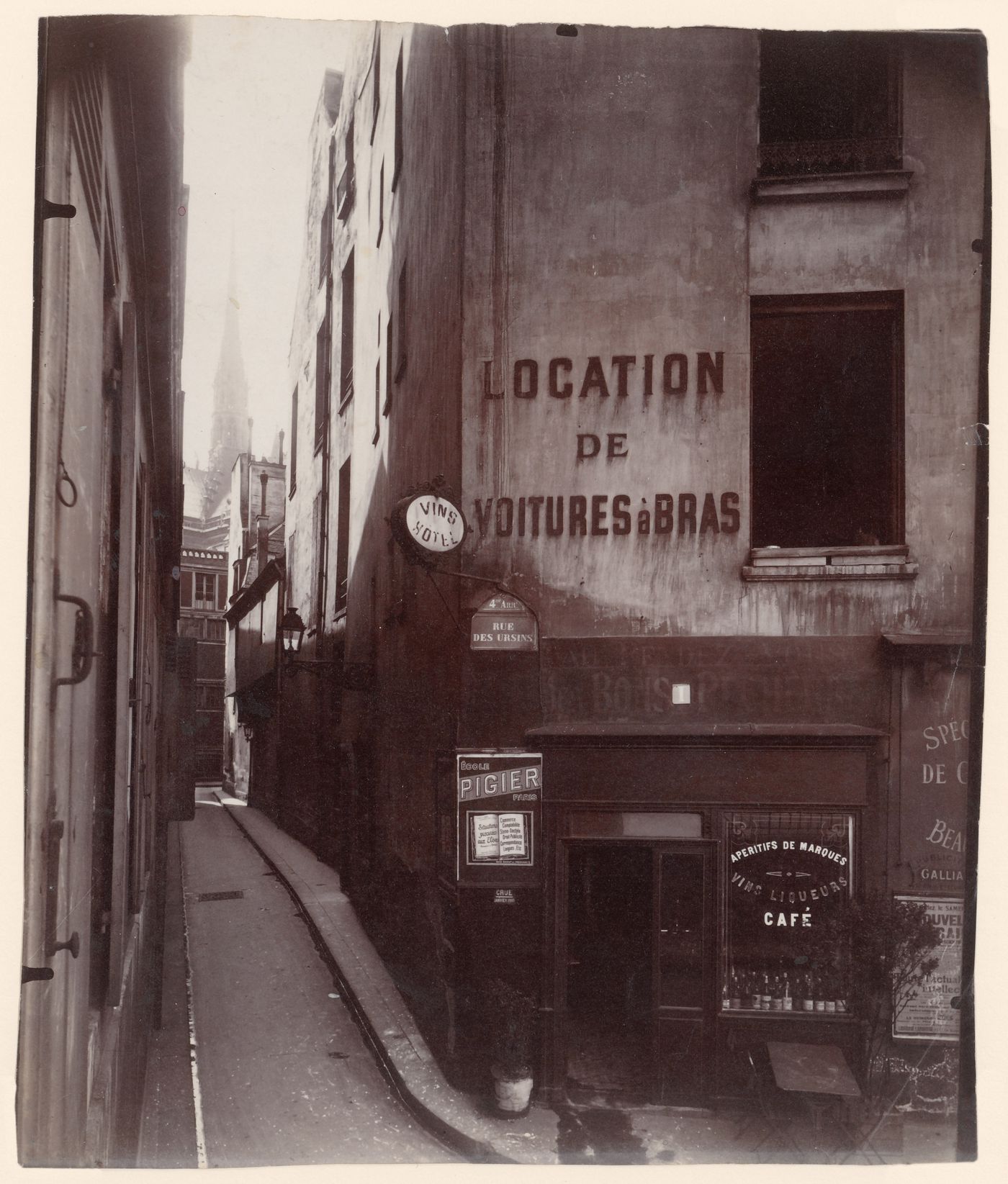 View down rue de Chantres, with spire of Notre-Dame de Paris in distance, Paris, France