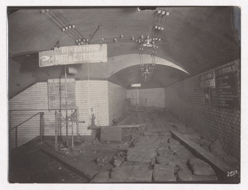Construction of the Paris Metro, interior view of hallway with signs pointing to the Porte de Clignancourt and Porte d'Orléans stations, Paris, France