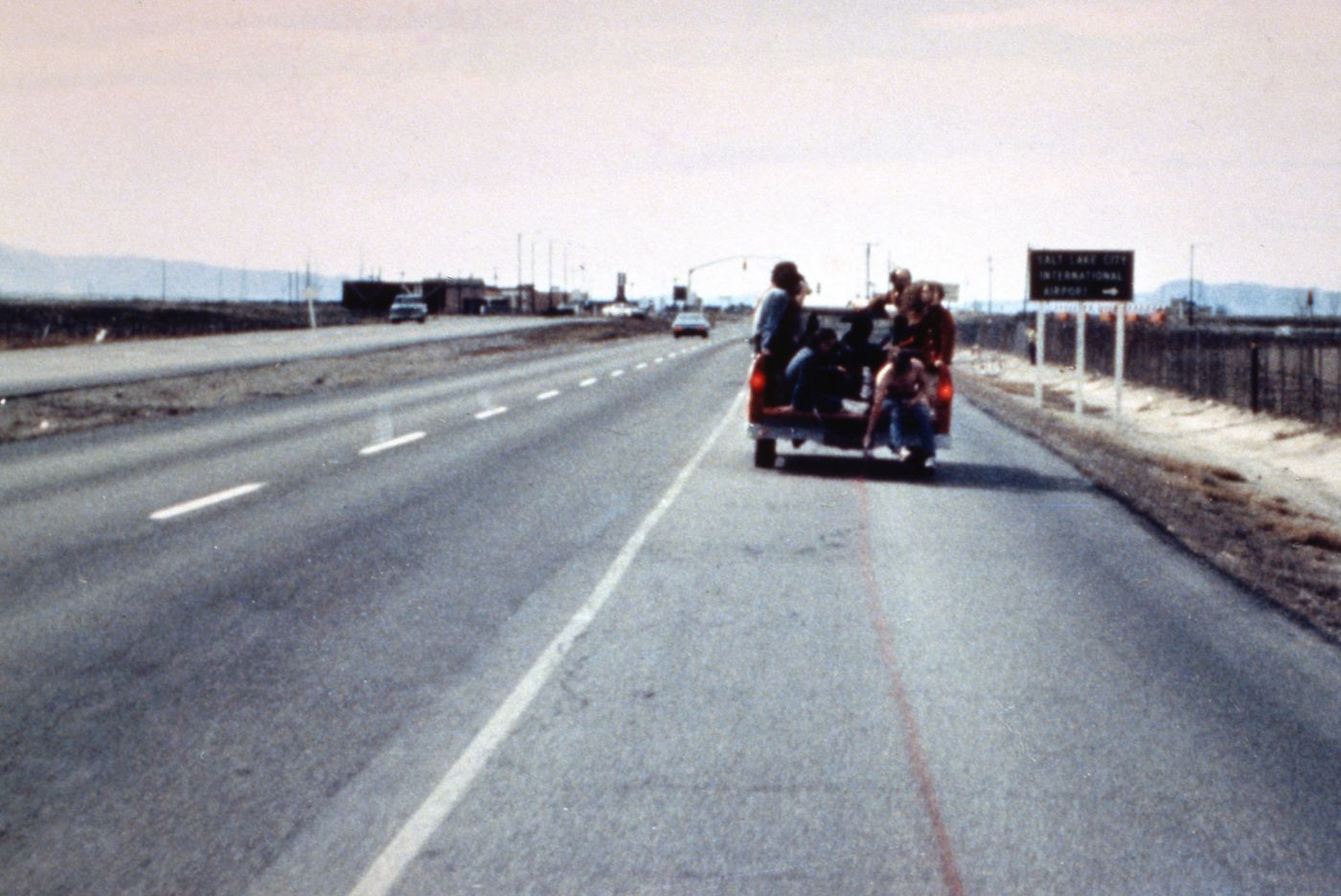 Photograph of students in back of truck during performance of Red Line