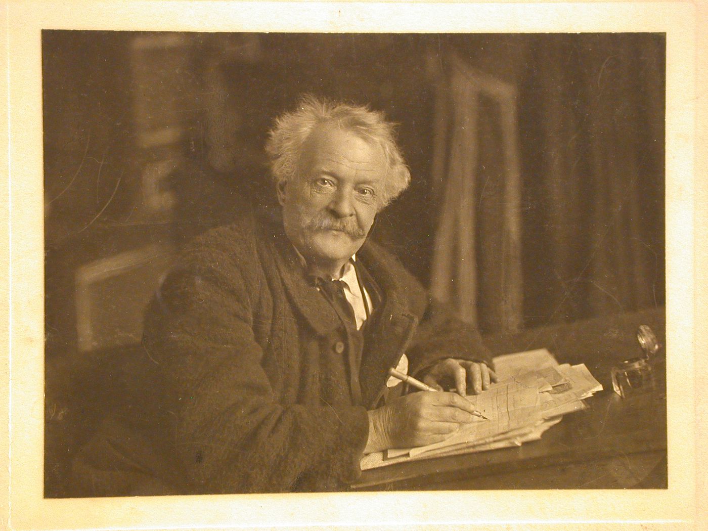 Portrait of Felix Nadar by his son, ca.1870s, at a writing desk