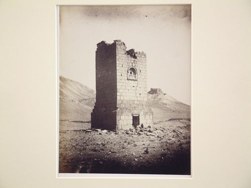 View of Tower tomb of Elahbel (now demolished) and Fakhr-al-Din al-Ma’ani (also known as Palmyra Castle) in the distance, Palmyra, Syria