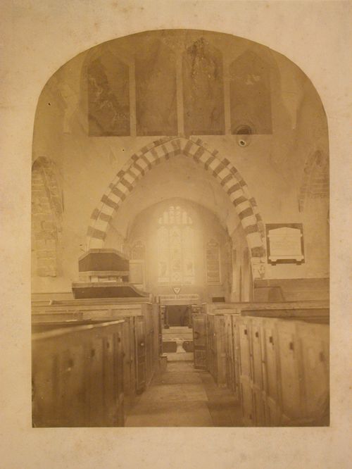 Interior view of the Church of All Saints showing the pews, pulpit and apse, Whiteparish, Wiltshire, England
