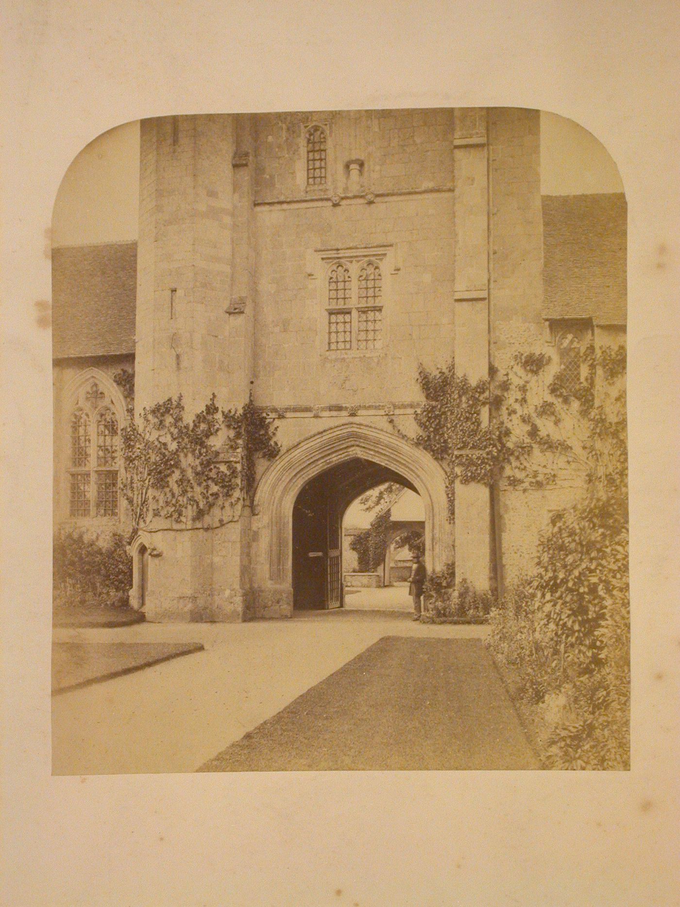 View through a passage under a tower of the Hospital of St. Cross, Winchester, Hampshire, England