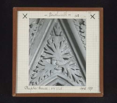Detail view of canopy with foliate mask on tympanum in Chapter House, Southwell Minster, Southwell, Nottinghamshire, England