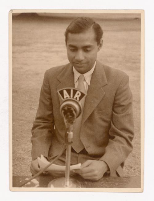 Photograph of Aditya Prakash speaking on the radio
