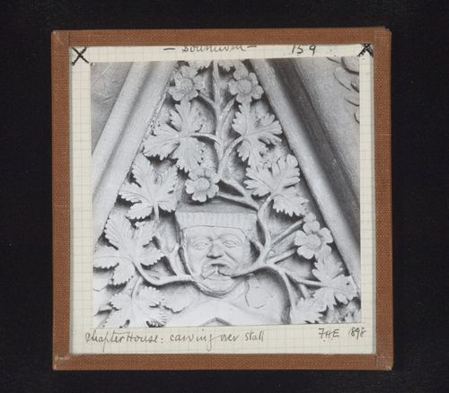 Detail view of canopy with foliate mask on tympanum in Chapter House, Southwell Minster, Southwell, Nottinghamshire, England