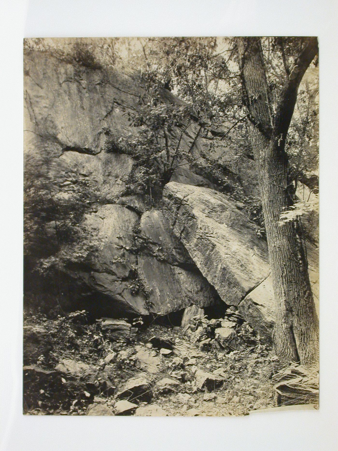 View of the base of a cliff showing a slab of rock meant to become the mantle for a clubhouse fireplace, Longue Vue Golf Course, New York [?], United States