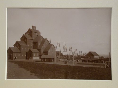 View of track and shaft buildings of a mine