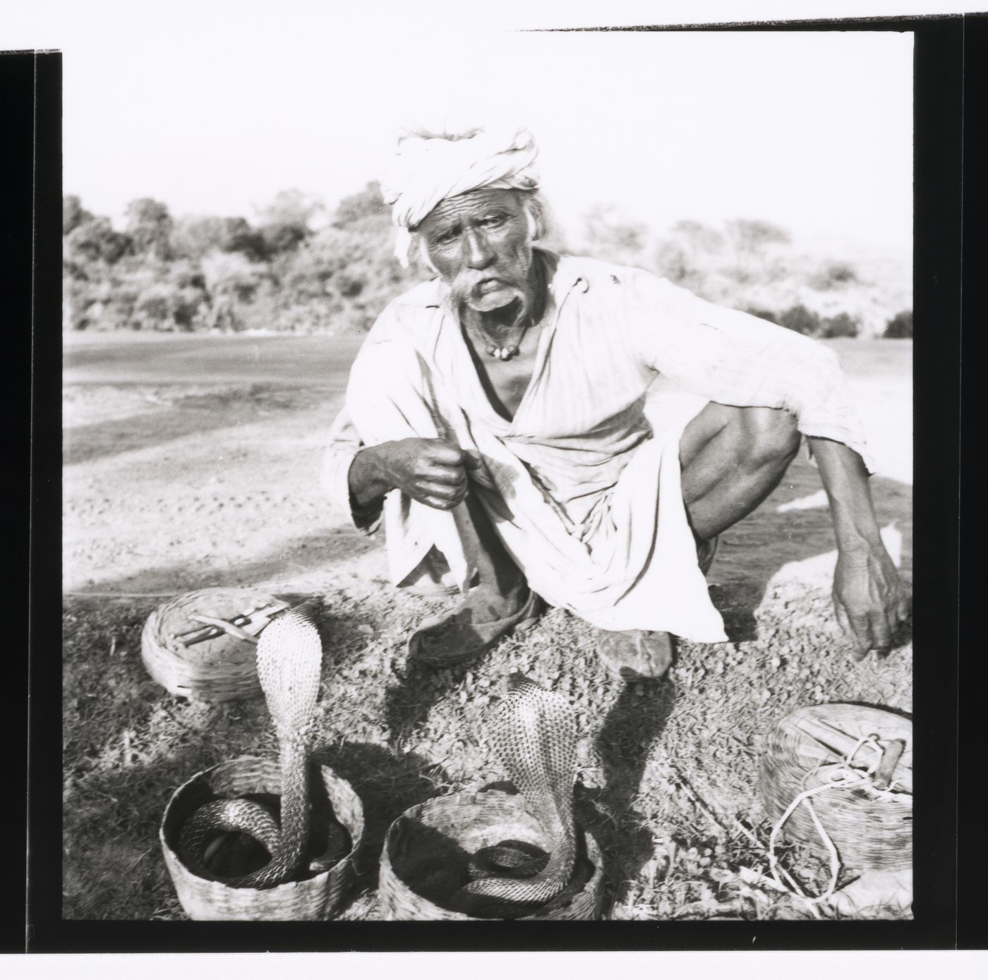 Snake charmer with two snakes near Chandigarh, India