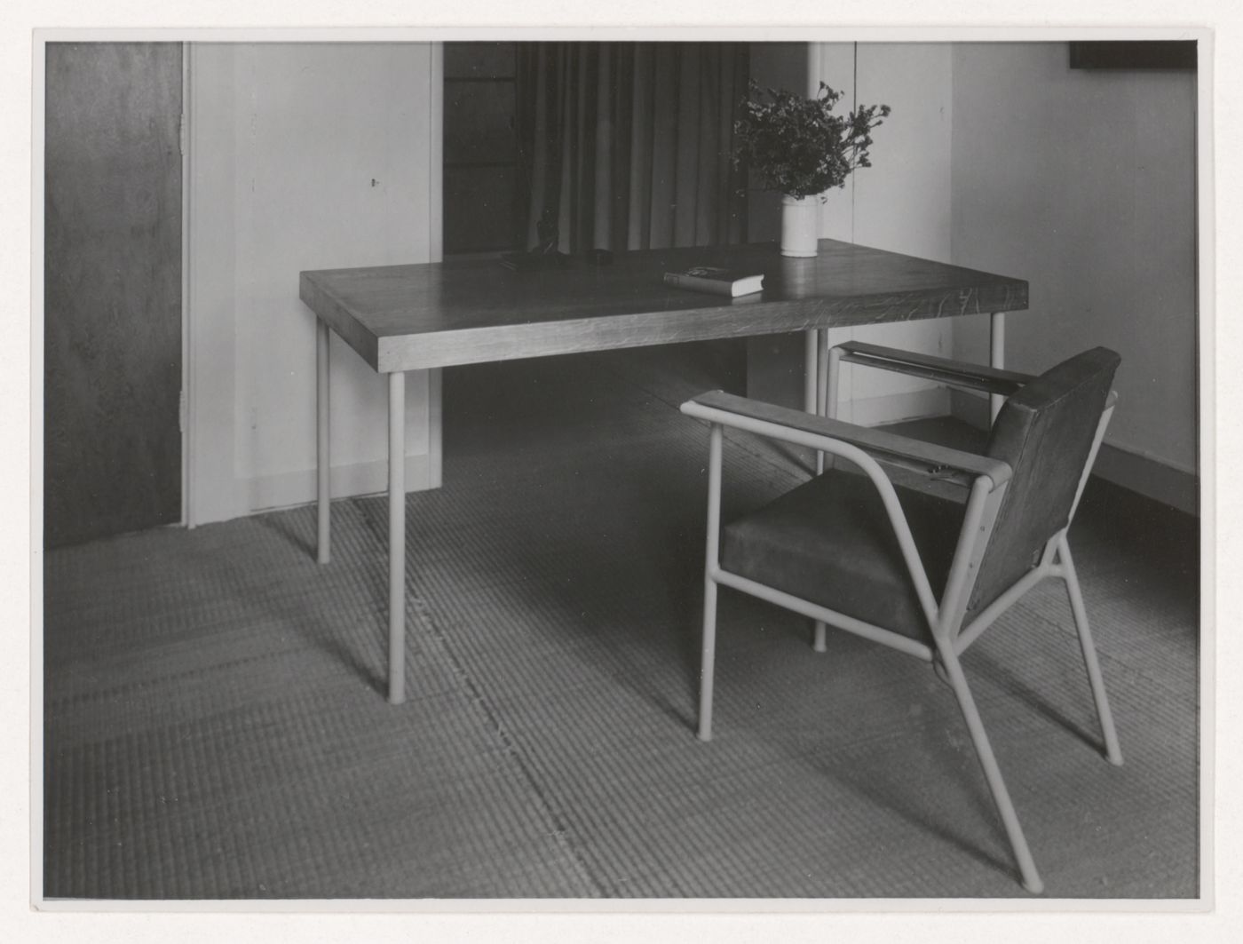 Interior view of Hannema House I showing a table and armchair designed by J.J.P. Oud, Rotterdam, Netherlands