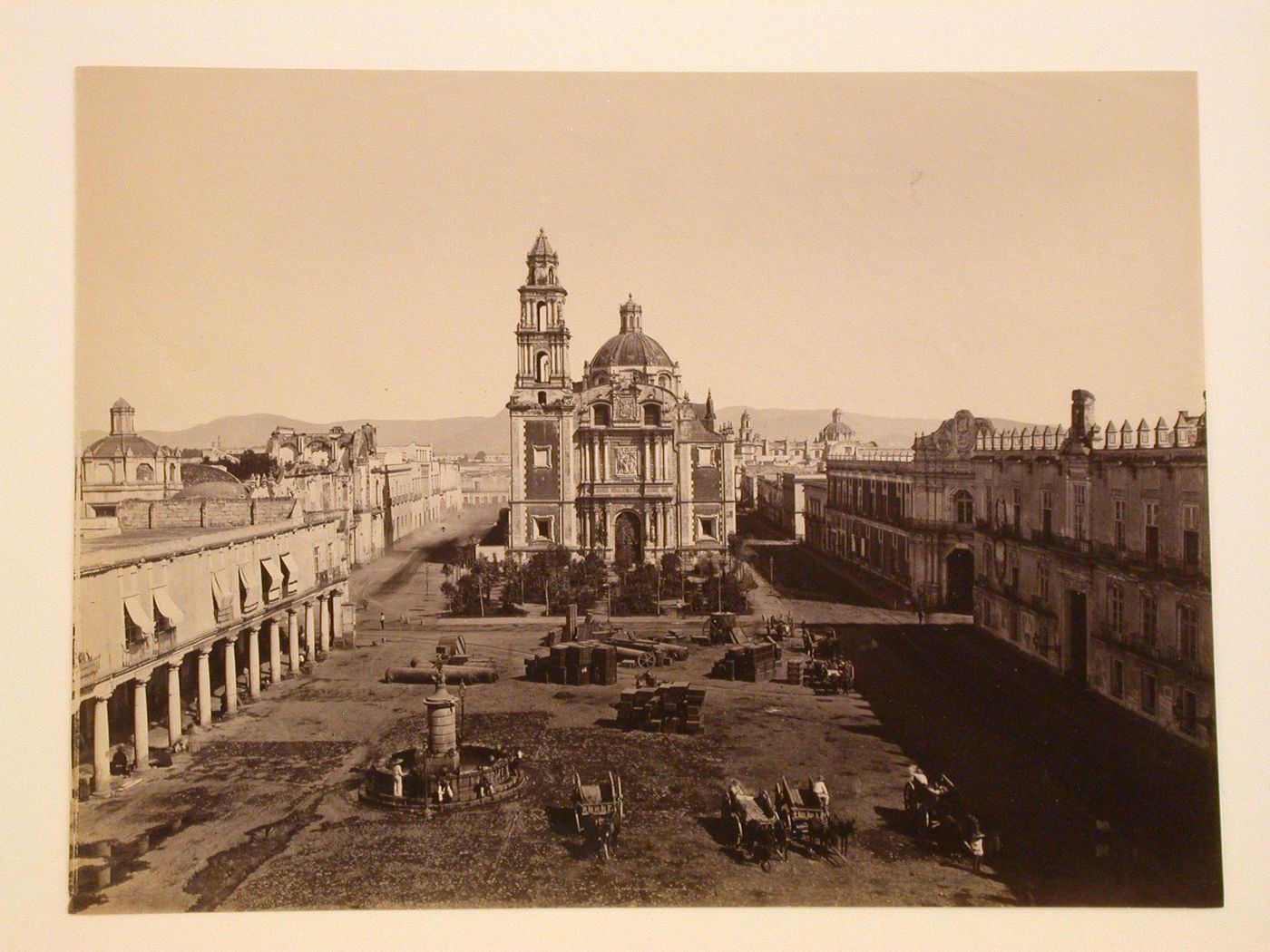 View of the Plaza Santo Domingo showing the Church of Santo Domingo, with the Portales de las Escribanías on the left, Tribunal de la Inquisición en México and Aduana de Santo Domingo on the right, and a fountain in the foreground, Mexico City, Mexico