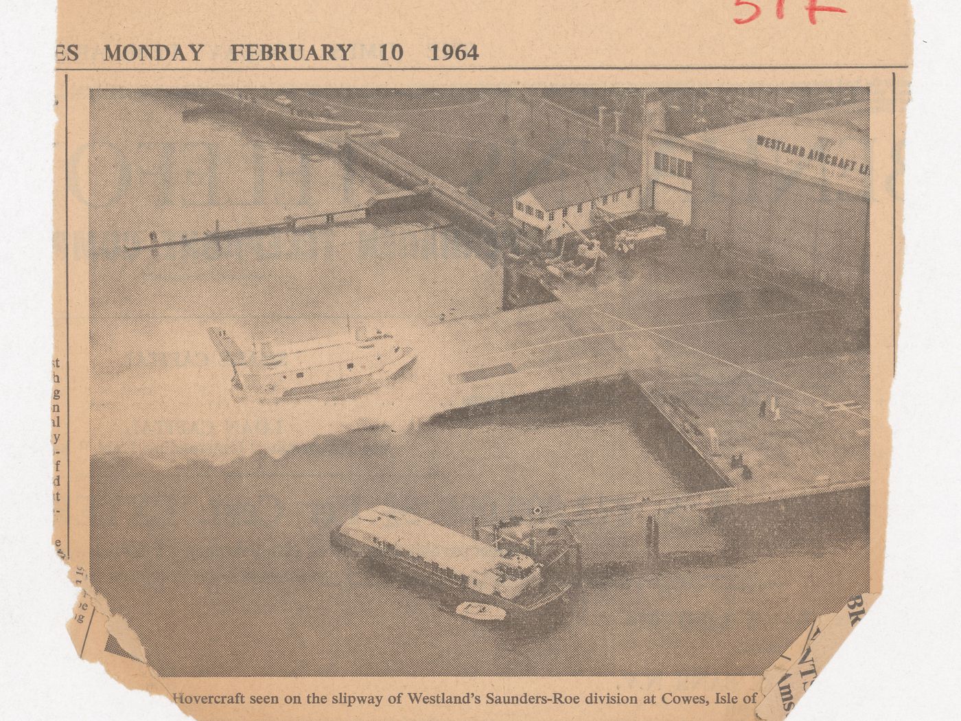 Newspaper clipping showing a photo of a hovercraft on the slipway of Westland's Saunders-Roe division