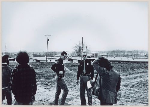 Photograph from the Red Line project showing Pettena's team and two police officers