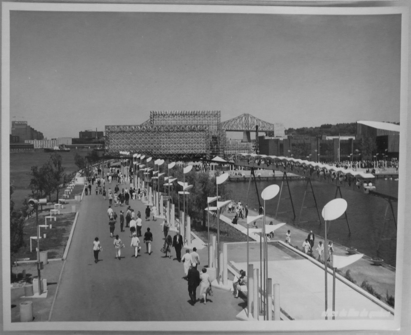 View of the walkway leading to the Netherlands and Belgian Pavilions with the minirail on the right, Expo 67, Montréal, Québec
