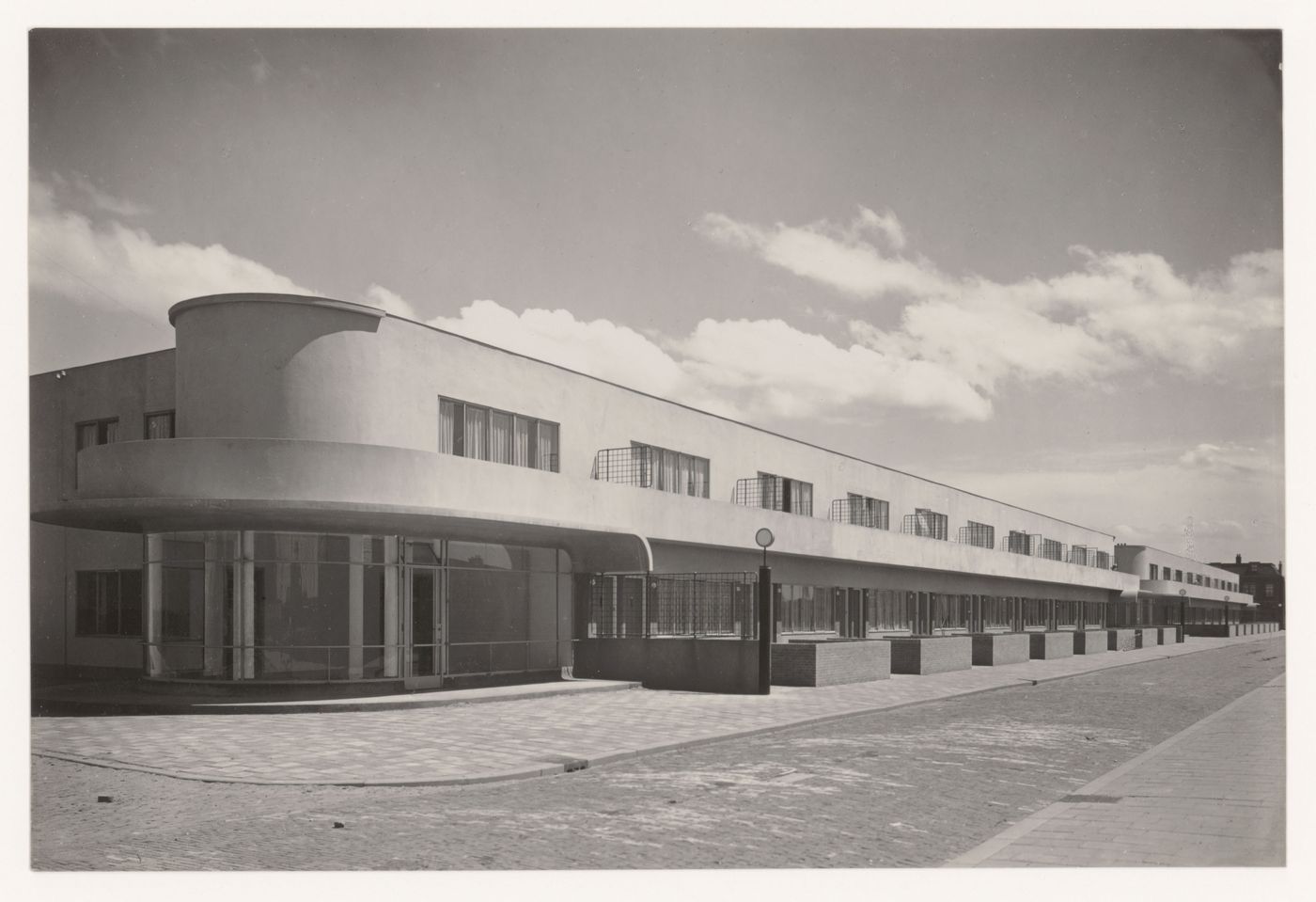 View of the principal façade of industrial row houses from across the street, Hoek van Holland, Netherlands