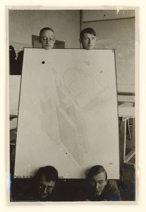 Portrait of Hannes Meyer, Aryeh Sharon and unidentified students at the Bauhaus in Dessau, Germany, holding a competition drawing by Hannes Meyer and Hans Wittwer for the League of Nations Building in Geneva, Switzerland