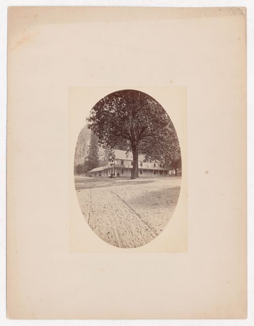 Road in foreground leading to Black's Hotel, two large trees, people out front, Yosemite Valley, California