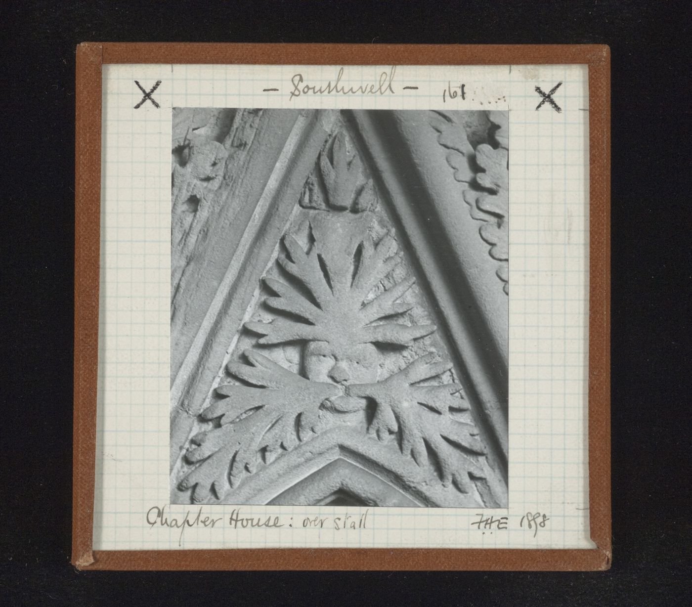 Detail view of canopy with foliate mask on tympanum in Chapter House, Southwell Minster, Southwell, Nottinghamshire, England