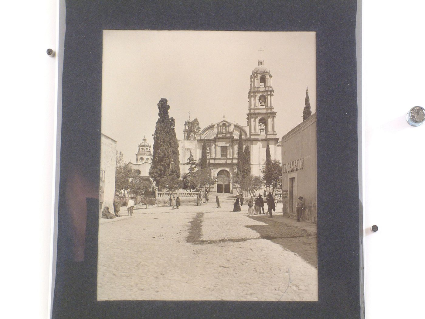 View of the principal façade of the Church of the Oratorio de San Felipe Neri showing the Chapel of Santa Casa de Loreto on the left and a street with people in the foreground, San Miguel de Allende, Mexico