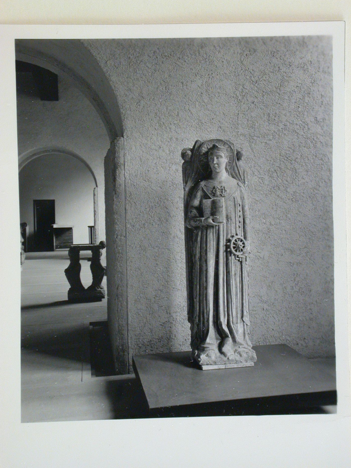 Interior view of a gallery showing a statue with doorways and other galleries on the left, Museo di Castelvecchio, Verona, Italy