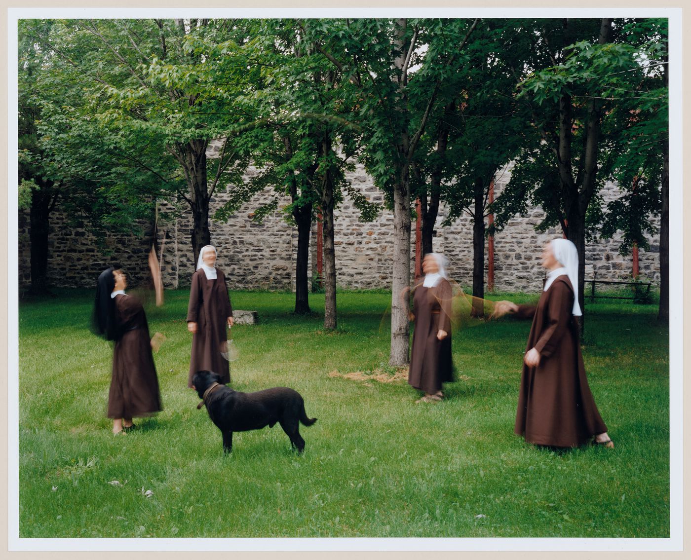 Group of Carmelite nuns playing badminton in their garden, from the Convent Series, Montreal, Canada