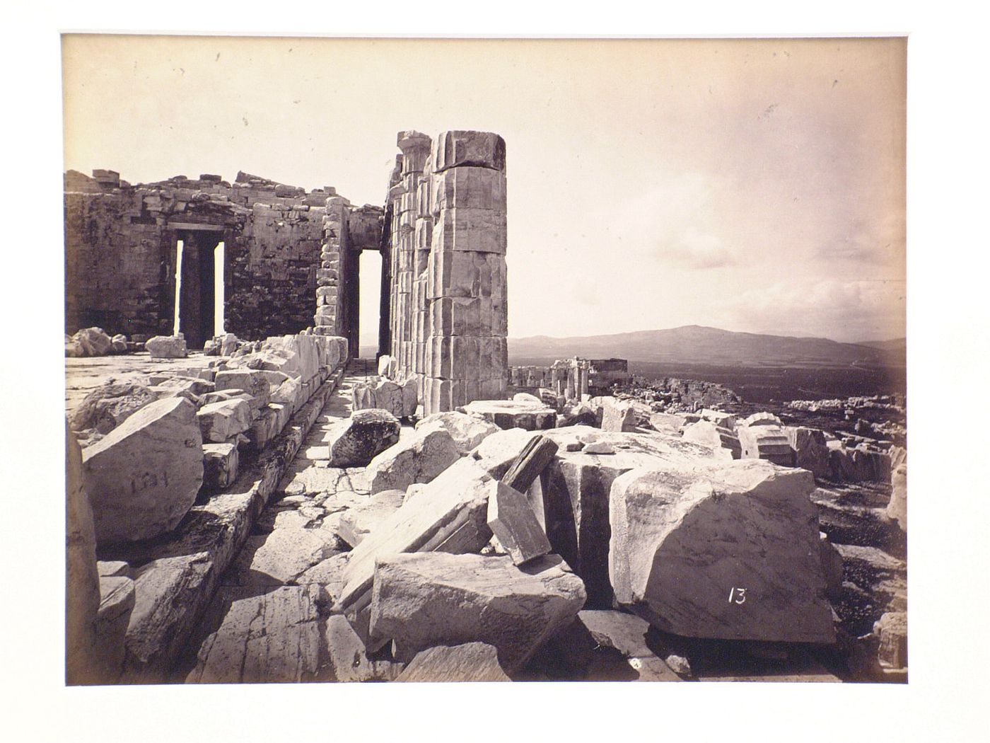 XIII. North Colonnade of the Parthenon, showing the road to Eleusis in the distance.