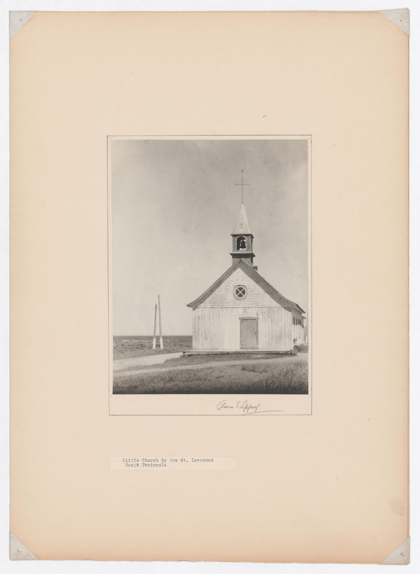 View of a wooden church with the Saint Lawrence River in the background, Gaspé Peninsula, Québec, Canada