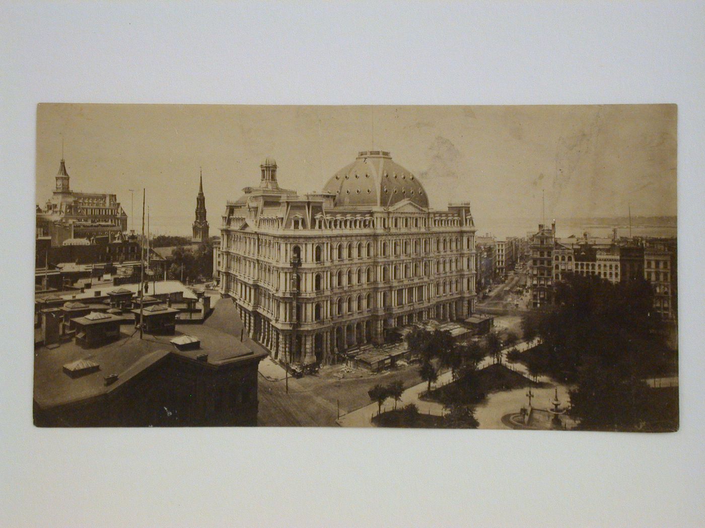View from a roof top of street corner with large domed building in center, park on right, New York City, New York