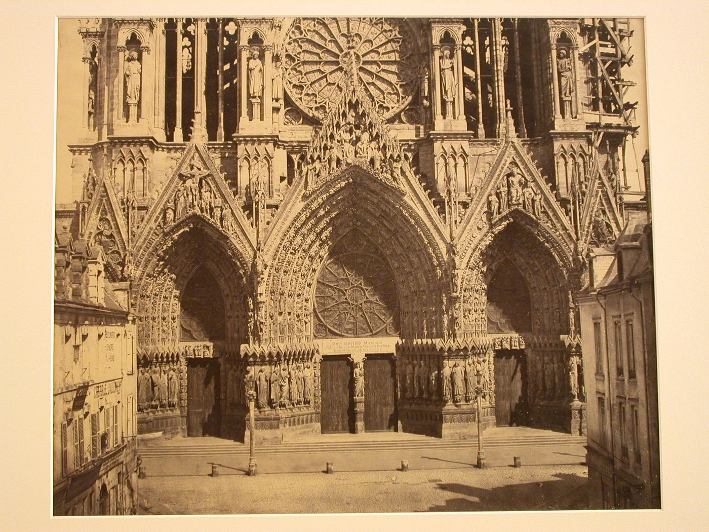 View of west façade excluding towers of Reims Cathedral, houses visible in foreground at the sides, Reims, France