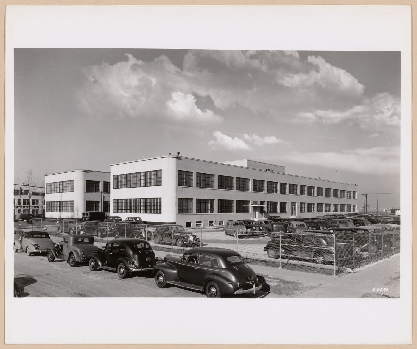 View of the principal and lateral façades of the Administration Building, United Aircraft Corporation Airplane Assembly Plant [?], Chicago, Illinois