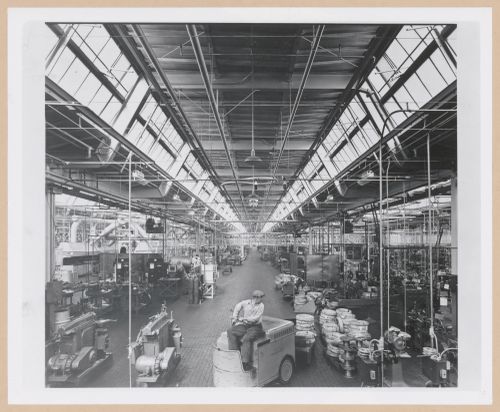 Interior view of the Manufacturing Building showing a worker using a forklift [?], General Motors Corporation Delco Appliance division Assembly Plant, Rochester, New York