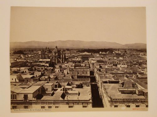 View of Mexico City from the Western tower of the Catedral de México showing the Iglesia de la Casa Profesa and the Church of the Convento de San Francisco on the left and the portico of the Teatro Nacional, with Aquillero Alley in the foreground, Mexico