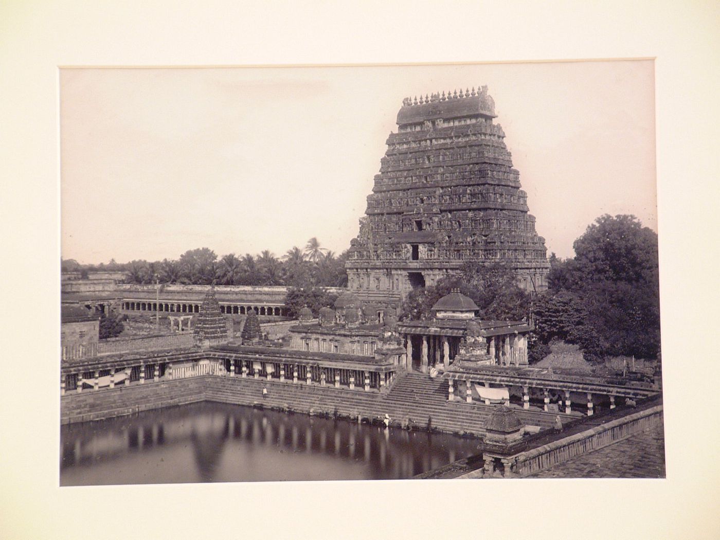 View of a gopura with the Shivaganga water tank in the foreground and a colonnade in the background, Nataraja Temple (also known as Chidambaram Golden Temple), Chidambaram, India