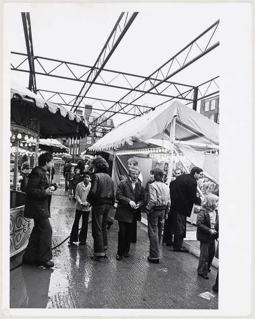 Inter-Action Centre, London, England: view of a fair held at the Centre between the 1st  and 2nd phases of construction