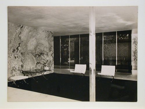 Interior view of the German Pavilion at the Barcelona International Exposition of 1929-1930 showing furniture and a sculpture titled "Der Morgen" [Dawn] by Georg Kolbe, Spain