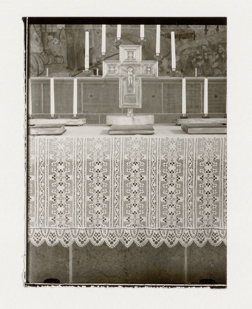 Interior view of the Chapel of the Holy Cross showing the altar dressed with an altar cloth, crucifix and candles, Woodland Crematorium and Cemetery, Stockholm