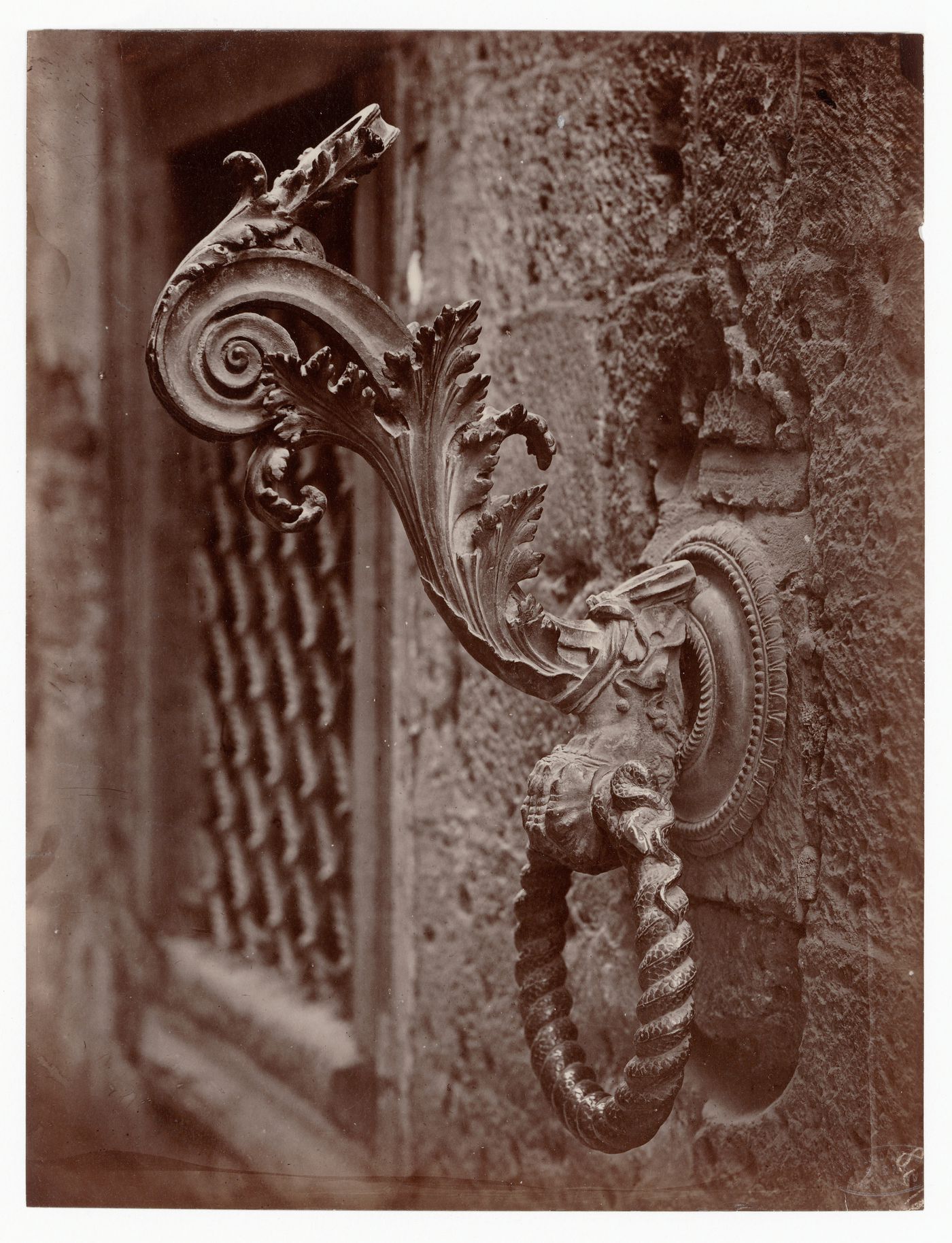 Close-up view of a torch holder beside [?] the Porta Bandiera in the Palazzo del Magnifico, Siena, Italy