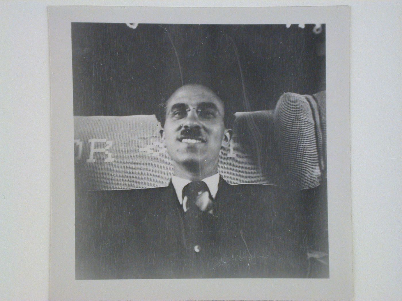 Portrait of André Bloc, editor of L'Architecture d'aujourd'hui, in a train car