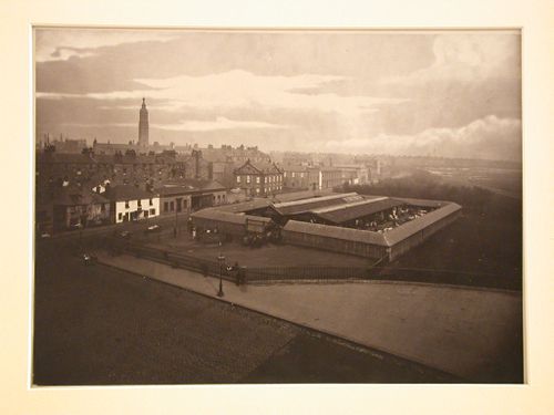 Distant view of enclosed clothes market, city in the background, Glasgow, Scotland