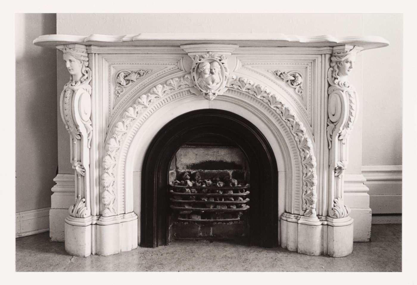 Interior view of the marble fireplace in a front room in the west part of Shaughnessy House (now the Grand Salon ?), Montréal, Québec, Canada