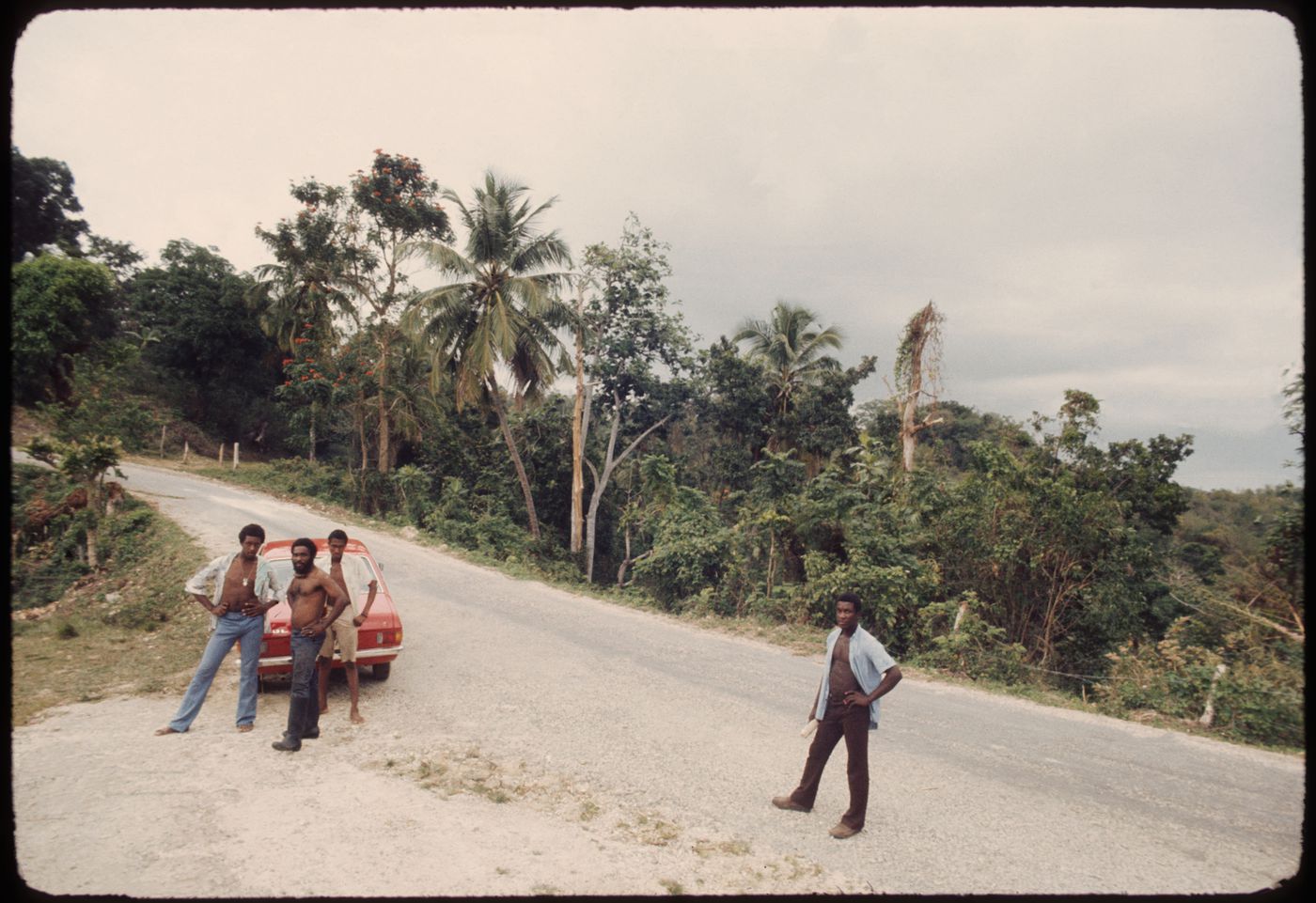 Men and parked car on the road, Jamaica