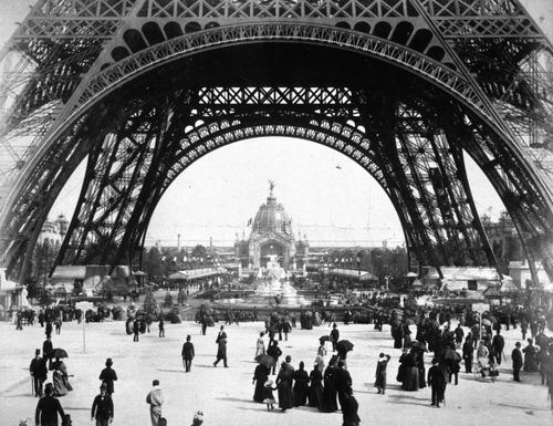 Exposition universelle de 1889 (Paris, France): View of the base of the Eiffel Tower with crowds beneath