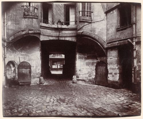 Courtyard side of Cartault's dragon portal, showing two stair turrets, Paris, France