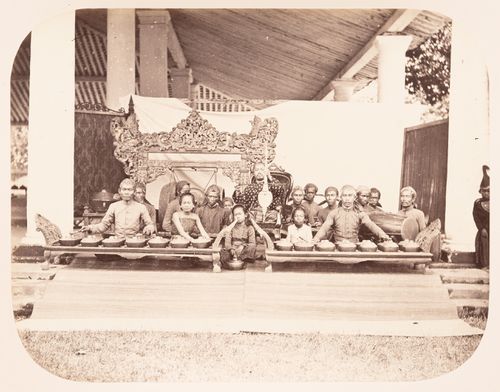 Group portrait of the musicians and instruments of a gamelan, probably in Bandong (now Bandung), Dutch East Indies (now Indonesia)