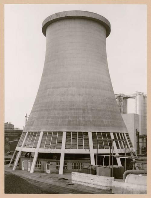 View of Metallhüttenwerk industrial plant showing a cooling tower, Lübeck-Herrenwyk, Germany